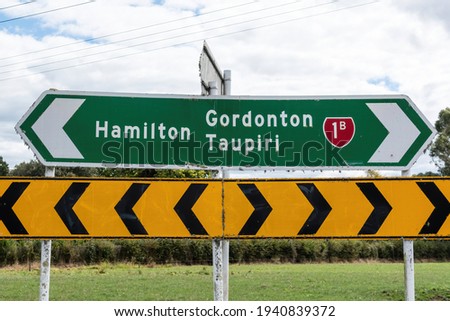 View of Hamilton, Grodonton and Taupiri road sign on State Highway 1 (1b), New Zealand