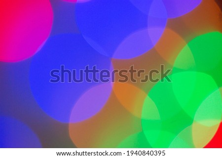 blurred bokeh light background , glare and glowing lights in night city, modern beautiful bright background
