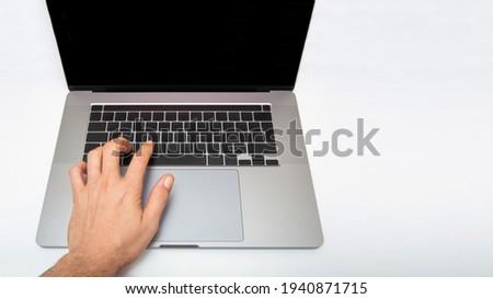 top view, male hand pressing computer keys. isolated white background