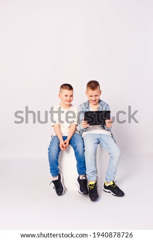 children look at the tablet on a white background