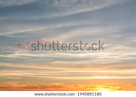 Beautiful texture (background) of the sky at sunset in warm colors. Sunrise in the morning.