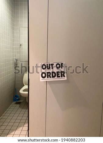 Out of order sign in a bathroom 