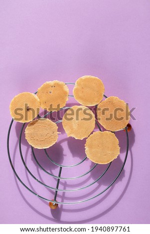 homemade cookies on purple background, creative food photography
