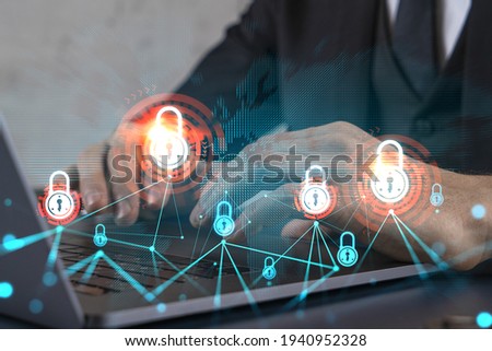 Businessman search for security options, typing laptop background and lock icons hologram.