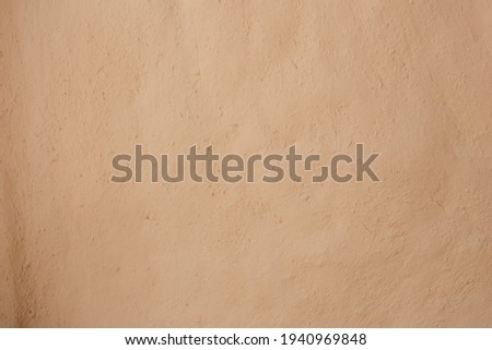 Blurred picture wall of home made from mud or adobe house. Clay wall texture of House structure. Soil building for background. soft picture. 