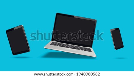 Flying laptop, mobile and tablet Royalty-Free Stock Photo #1940980582
