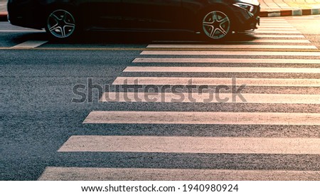 crosswalk on the road for safety when people walking cross the street, Pedestrian crossing on a repaired asphalt road, Cross walk on the street for safety,logistic import export and transport industry