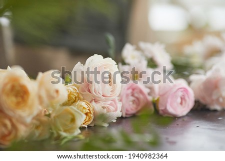 Extreme close up of beautiful flowers arranged on table in florists workshop, copy space