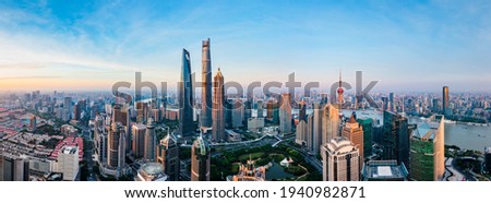 Aerial view of modern city skyline and buildings at sunrise in Shanghai. Royalty-Free Stock Photo #1940982871