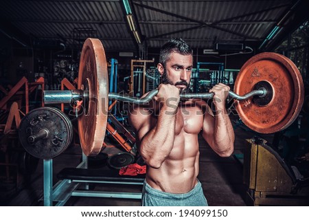 bodybuilder in training room  Royalty-Free Stock Photo #194099150