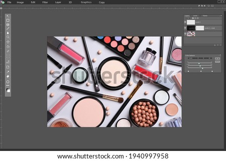 Professional photo editor application. Image of different cosmetic products on light grey background