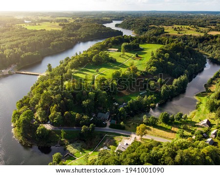 Aerial landscape of Dubingiai Castle Hill, former island, now a peninsula, located by Lake Asveja, the longest lake in Lithuania. Cognitive trail through archaeological and natural sites. Royalty-Free Stock Photo #1941001090