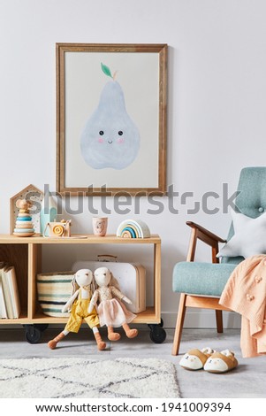 Cozy interior of child room with mint armchair, brown mock up poster frame, toys, teddy bear, dolls, plush animal, decoration. White wall. Warm kid space. Template.