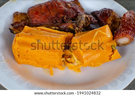 Traditional recipe from Panamanian cuisine and there are a variety of them. The picture shows one made from yellow corn dough, condiments and stuffed with chicken meat