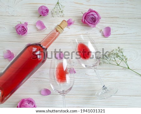 wine glass flower rose on wooden background