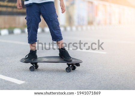 Close Up leg on surf skate or skateboard on a skate park extreme sports. Concept family activity lifestyle of the new generation for good health and exercise