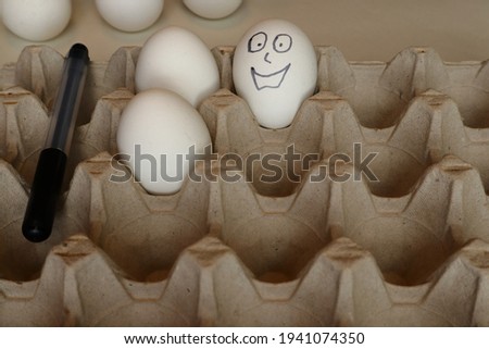 Happy painted easter eggs. Smiling face. Close up and isolated. Perparing for easter day and holidays. Blurry background. Swedish tradition. Copy space for text. Stockholm, Sweden, Europe.