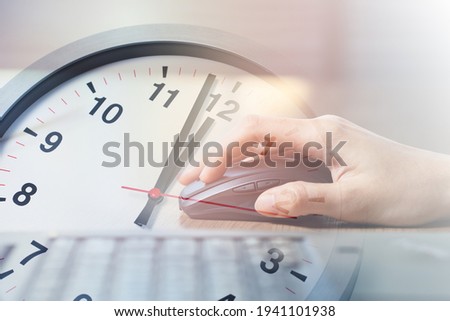 Closeup Business Woman Working with Laptop computer overlay with Afternoon Break Lunch Times Clock for Office Working Hours Concept Royalty-Free Stock Photo #1941101938