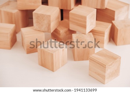 Stack wooden blocks from natural wood on a white background. Copy, empty space for text.