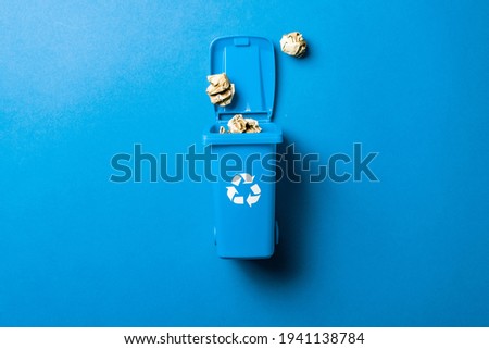 Recycling icon. Bin container for disposal garbage waste and save environment. Blue dustbin for recycle paper trash isolated on blue background Royalty-Free Stock Photo #1941138784