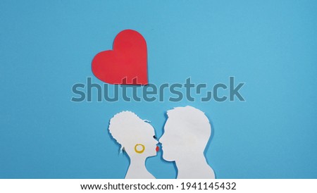 Young couple are kissing. Our love is organic. Colored applique or paper cut. Valentine's Day, Easter, Birthday, Happy Women's Day, Mother's Day. Flat lay, top view, copy