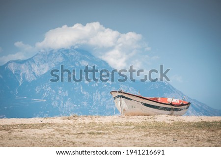 Stranded boat with a big mountain in the background