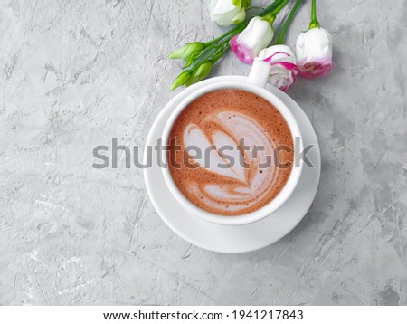 cup of coffee, rose flower on concrete background