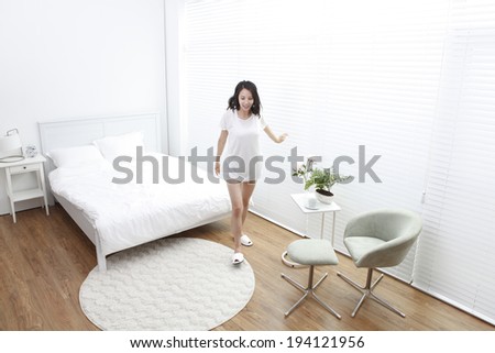 the image of Asian woman waking up