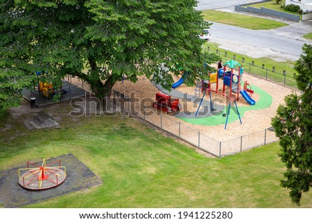 Looking down on the colourful playground and park area from the walkway above, Roxburgh, Central Otago, New Zealand Royalty-Free Stock Photo #1941225280