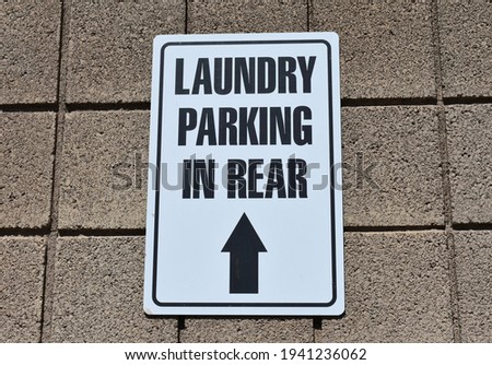 Laundry Parking In Rear Sign With Arrow
