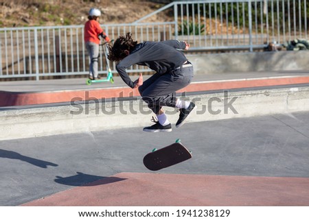 young man jumping on skateboard

