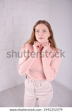 Young beautiful girl show clothes for an online store.  Bright clothes.