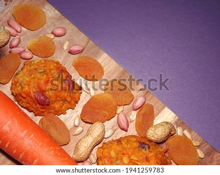 carrot diet cookies with carrots, dried apricots, peanuts and sunflower seeds with space for text. High quality photo