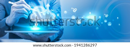 Businessman using tablet computer to connecting data information and communication online. Panoramic banner of networking technology and social media