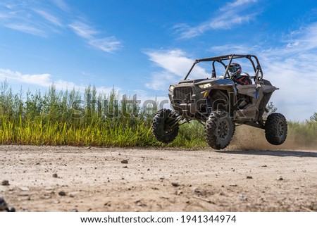 ATV adventure. Buggy extreme ride on dirt track. UTV Royalty-Free Stock Photo #1941344974