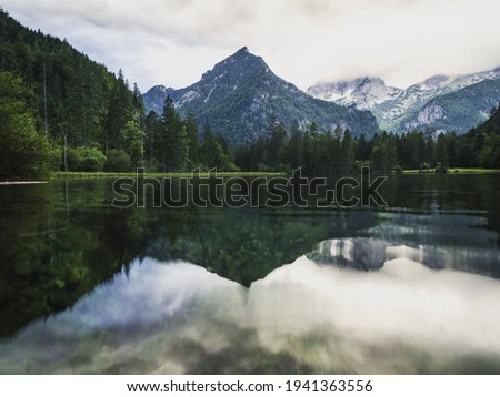 Alpine mountain lake mirror pond water reflection at Schiederweiher Krumme Steyr river in Hinterstober Upper Austria alps Europe Royalty-Free Stock Photo #1941363556