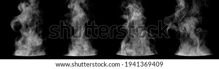 Set of steam from round dishes - pots, mugs or cups isolated on black background Royalty-Free Stock Photo #1941369409
