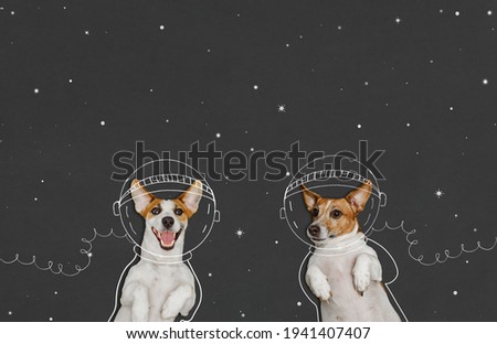 Cute dogs in the space suit drawing on blackboard. First trip to space concept. 12 april day, astronautics day, back to school, successful, future, education concept.