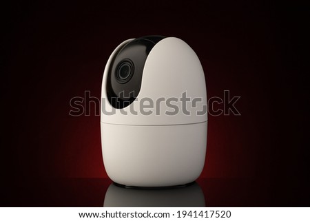 Security camera against dark background in red light