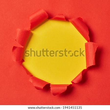 Red and yellow torn paper