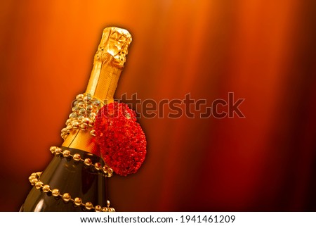 a holiday card.a bottle of champagne on a brown background. Copyspace