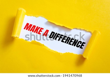Make a Difference. text on white paper over torn paper background.