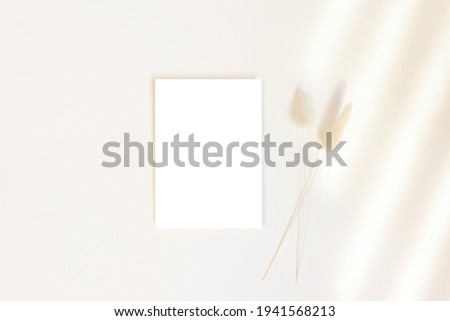 5x7 card mockup with dry flowers on beige background