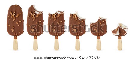 Brown bitten chocolate popsicle ice cream with nuts arranged in a row, isolated on white background.