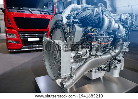Disassembled engine at a truck repair service Royalty-Free Stock Photo #1941685210