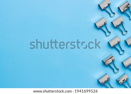 Stationery pattern, office supplies background. Paper binder clips top view