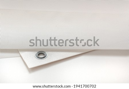 Printed mesh banner from the printing house. Royalty-Free Stock Photo #1941700702