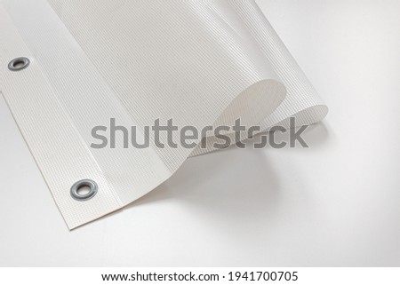 Printed mesh banner from the printing house. Royalty-Free Stock Photo #1941700705