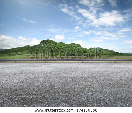 beauty Country Road Side View and mountain background Royalty-Free Stock Photo #194170388