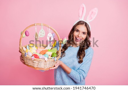 Photo of funny lady showing easter basket open mouth wear rabbit ears headband blue sweater isolated pink background